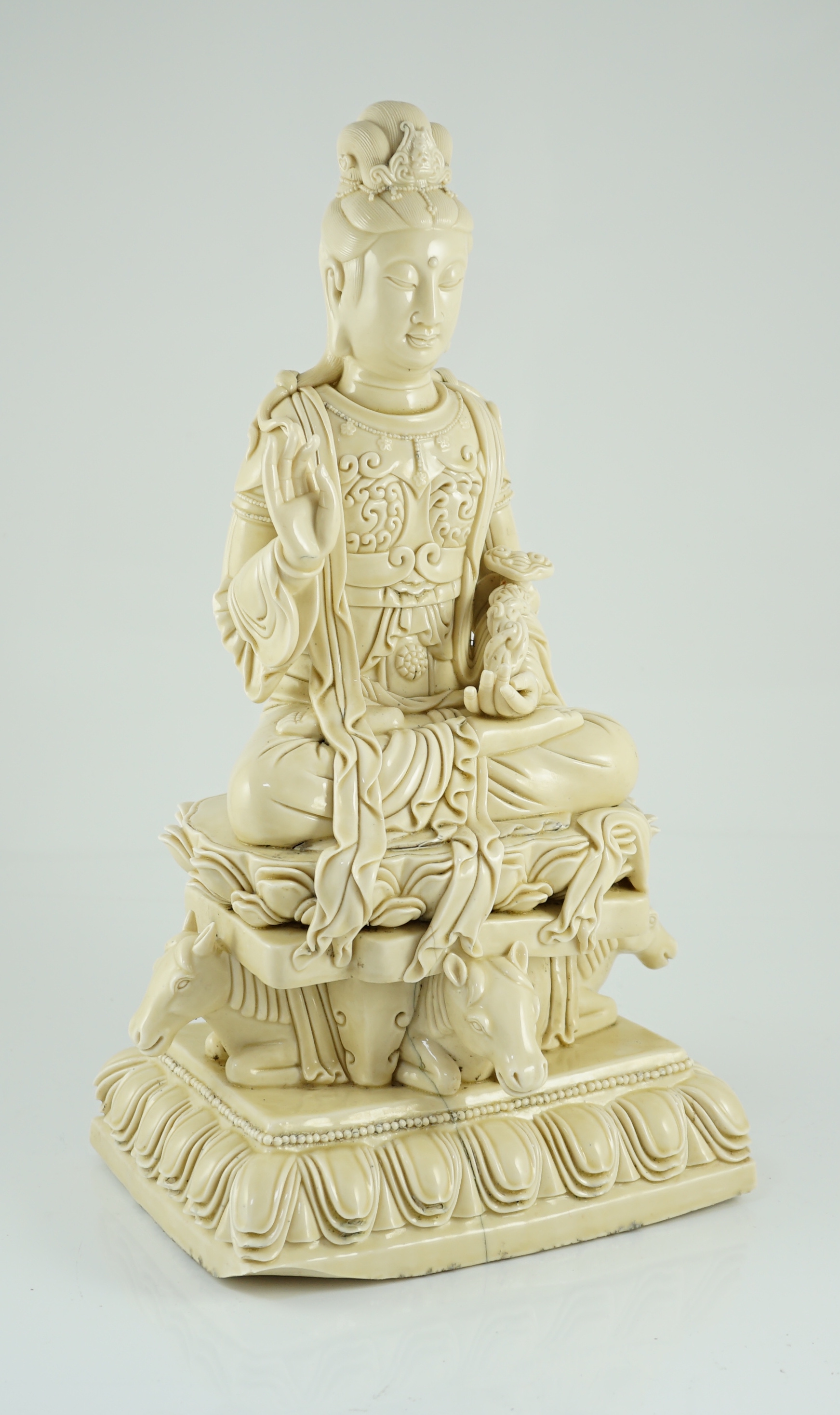 A large Chinese Dehua blanc de chine figure of Guanyin, Republic period, He Chaozong mark within a double gourd